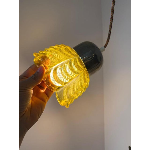 An East German design highlight from the Space Age era: This pendant lamp, model type 1545-02, from VEB Narva Leuchtenbau...