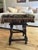 Solid oak footstool featuring traditional pegged mortise-and-tenon construction, turned legs, and stretcher base....