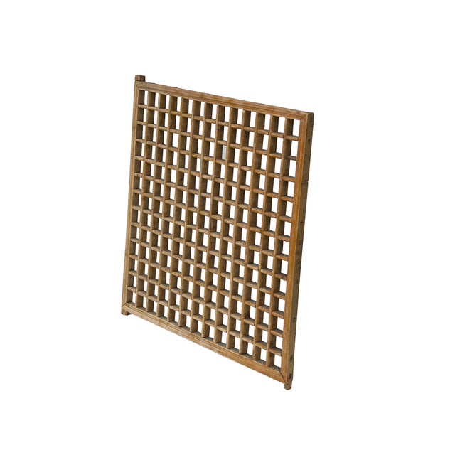 This vintage wooden lattice screen features a classic square-grid design, characteristic of traditional East Asian...