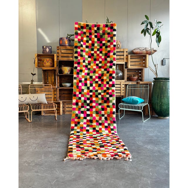 This Moroccan Boujad runner rug is an authentic handwoven piece from the Middle Atlas region, celebrated for its bold...
