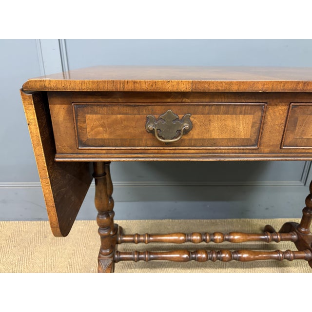 A very good Georgian style burr walnut sofa table. Of good construction in solid walnut with burr walnut veneers. The pair...