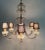 This is a Florentine Rococo style chandelier handmade in Florence, Italy circa 1950 with an array of crystals on a gilded...