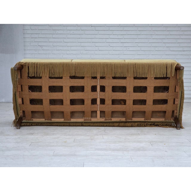 1970s, Danish 3-seater sofa. Original light green furniture velour, brass springs in the seat, oak wood legs. Original...