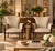 Beautiful pair of vintage Regency Revival armchairs featuring elegant carved wood frames, tall flared backs and cream...