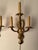 Pair of late 19th-century French Neoclassical style bronze wall sconces featuring angel figures with three-arm...