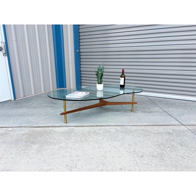 Mid-Century Modern 1960s Mid-Century Modern Freeform Glass Coffee Table With Walnut and Brass Base For Sale - Image 3 of 14