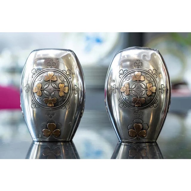 Pair of small silver and vermeil vases - Minerva hallmark; finely chiseled decoration with clover decoration and...