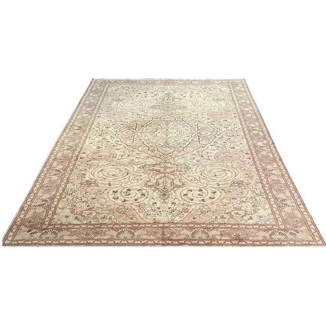 ACTUAL SIZE: 8’5″ x 12’0″ PRIMARY COLOR: Peach / Ivory AGE: Old ORIGIN: Turkey MATERIALS: Wool FOUNDATION: Cotton...