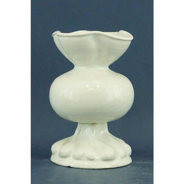 Item : A ceramic vase, entirely hand-crafted and modeled on a lathe, then glazed in white and vitrified, signed under the...
