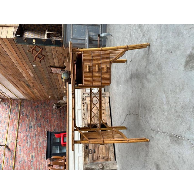 This 60's rattan desk has 3 functional drawers and a small storage niche Nice patina of use. I have official proof of...