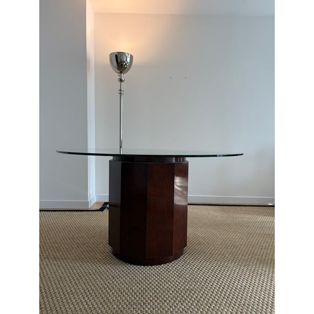 Ralph Lauren Perrin Dining Table in Mahogany with Custom Glass Top An iconic and sculptural dining table from Ralph...