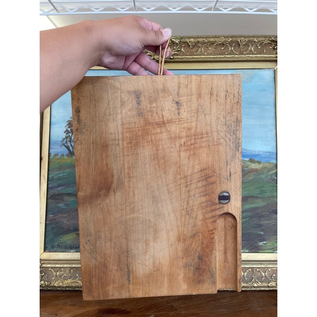 A substantial vintage butcher block cutting board crafted from solid maple by Mountain Hardwood, Adams Co. of Dorset,...