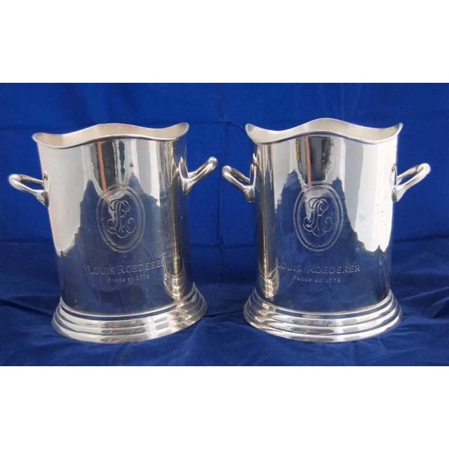 You are viewing a pair of handsome, silver-plated champagne buckets made by Louis Roederer, stamped on the front and...