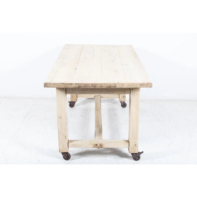 Antique Circa Mid 20thC French bleached oak table on castors Sourced from North France Measures: W180 x D87 x H81 cm.