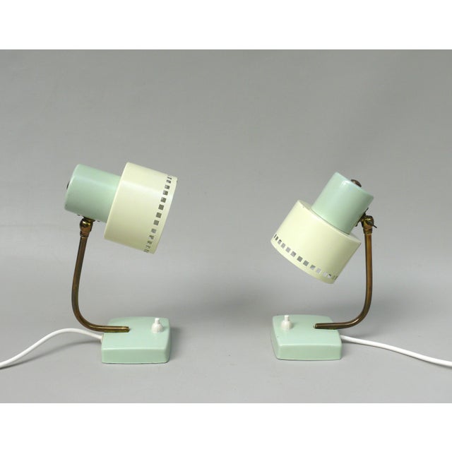 Bedside lamps made entirely in the style of the 50s. In contrast to the pastel-colored paintwork in the mint green and...