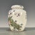 This is an elegant vintage Chinese porcelain tea jar, decorated in the famille rose palette with vibrant polychrome...