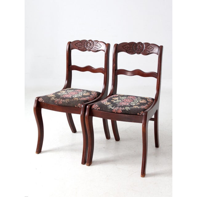 This pair of vintage Tell City chairs dates to the mid-20th century and showcases classic Colonial Revival styling with...