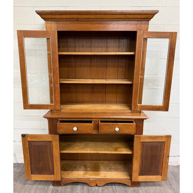 This is a gorgeous antique American primitive farmhouse step-back cupboard crafted of solid oak circa 1880–1900. Featuring...