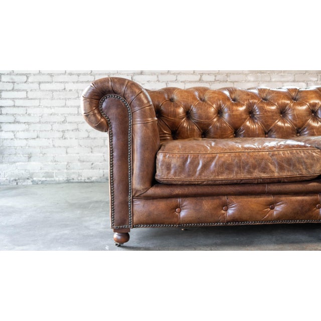 Lovely Restoration Hardware Kensington sofa in a beautiful distressed cigar leather, designed by Timothy Oulton. Deep...
