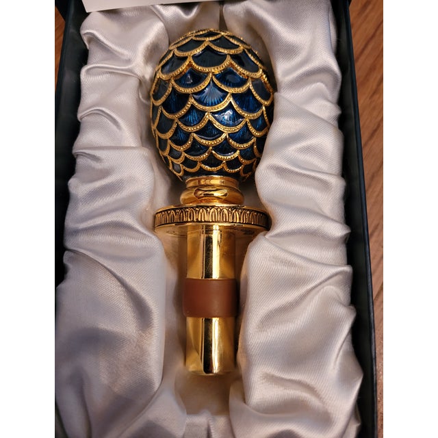 This Faberge Pine Cone egg wine bottle stopper is a representation of elegance. The Imperial egg Cobalt blue enamel...