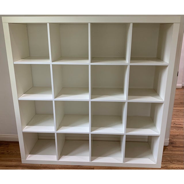 White melamine cubby bookcase with 16 compartment cubbyhole bookshelves in the parsons style. Purchased from Environment...
