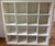 White melamine cubby bookcase with 16 compartment cubbyhole bookshelves in the parsons style. Purchased from Environment...