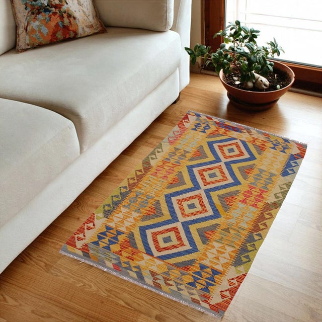Add a touch of elegance to your home with this casual chic hand woven Tribal Kilim wool rug. Constructed on a loom by...