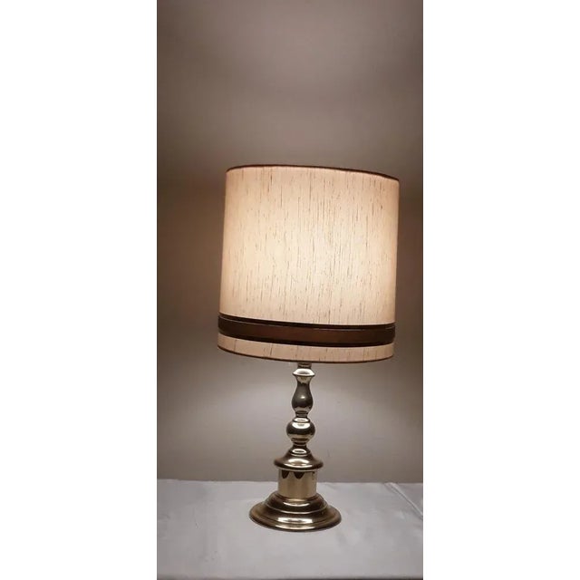 Vintage German Table Lamp with Brass Base and Cream-Colored Fabric Shade, 1970s, in Very Good conditions. Designed 1970 to...