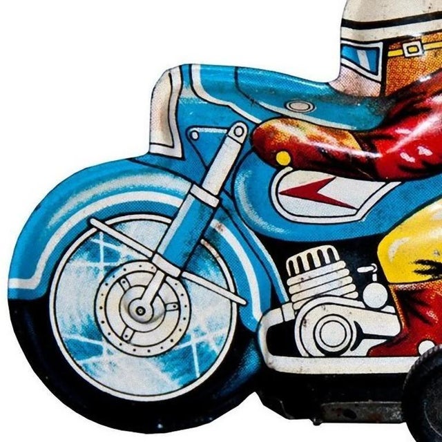 This Wind up Boy on Tricycle is an original vintage toy. Vintage friction toy representing a motorcyclist on his bike....