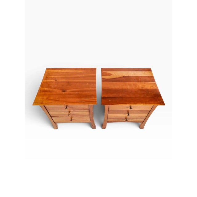 A matched pair of solid cherry bedside chests by Thor's Elegance, the family-run Vermont workshop that has been building...