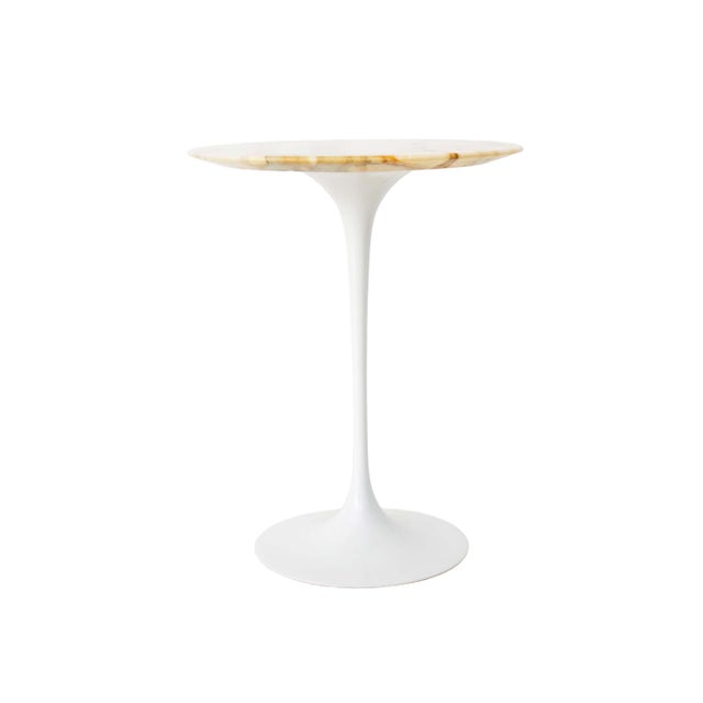 This Tulip side table was designed by Eero Saarinen as part of his renowned Pedestal Collection for Knoll. with this...