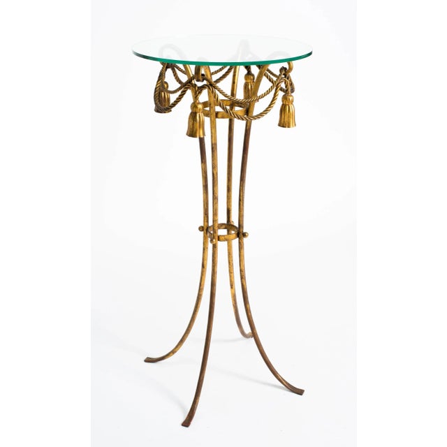 Italian gilt metal tassel pedestal or fern stand with glass top.