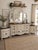 A beautifully hand-refinished bedroom collection featuring a substantial nine-drawer dresser, two matching nightstands,...