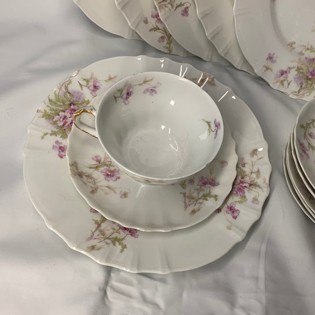 Elevate your next gathering with this stunning vintage porcelain tea and coffee set featuring a delicate pink floral...