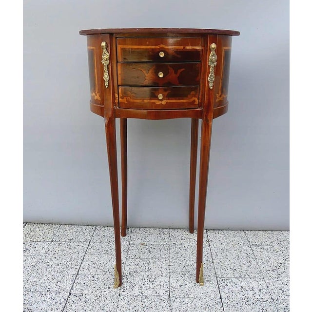 Bring timeless French elegance into your home with this exquisite French Louis XVI round side table, expertly handcrafted...