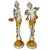 A dramatic and sculptural pair of 24-inch vintage Italian Baroque style figural candlesticks. Crafted in the classical...