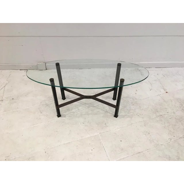 Model Canasta by Mathieu Matégot, circa 1960. Coffee table with four square section legs covered in black leather with...