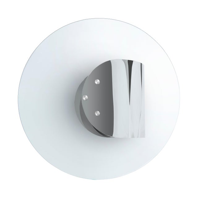 Modern Stainless Round Cocktail Table designed by Greg Sheres. The "cufflink" coffee table is a simple curving form made...