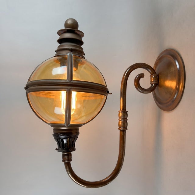 A majestic and rare lighting element, ideal for elegantly enhancing entryways, porches, or large reception rooms. This...