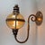 A majestic and rare lighting element, ideal for elegantly enhancing entryways, porches, or large reception rooms. This...