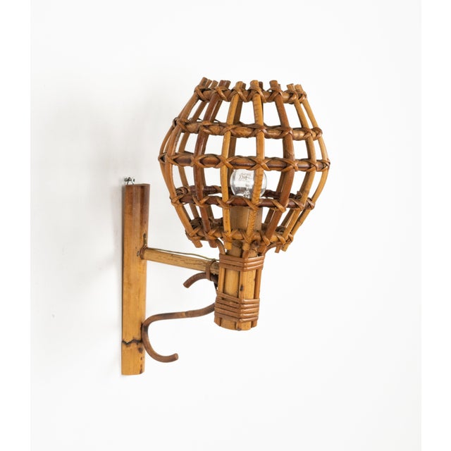 Midcentury amazing sconce "Lantern" wall lamp in rattan and bamboo, attributed to Louis Sognot, France, 1960s. A wonderful...