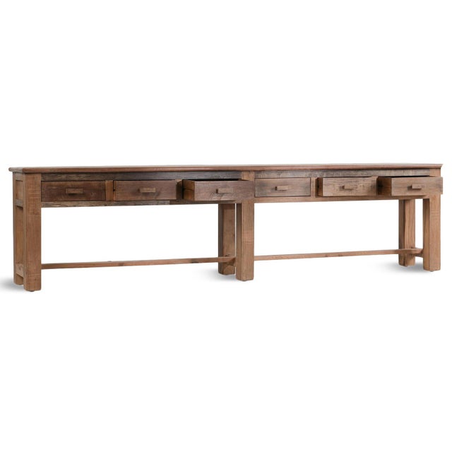 Solid salvaged wood long farmhouse console table with six drawers. Each may vary in natural wood tones, grain, and...