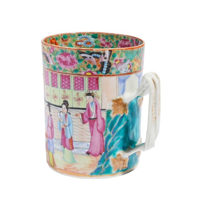 Mandarin Palette mug in polychrome enamels with gilt highlights and twisted strap handle. The exterior is handsomely...