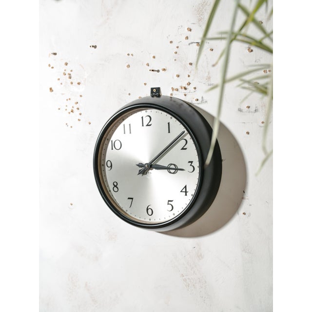 An original g.p.o. Wall clock from the 1960s, its synchronome movement still fitted inside, the mark of one of the most...