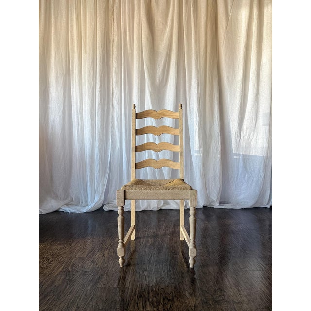 This charming set of six French ladderback chairs features a beautifully bleached oak finish that highlights the natural...