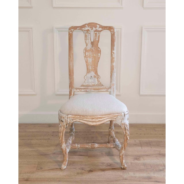 An authentic Swedish Rococo chair manufactured in Stockholm circa 1760. This period example retains its original painted...