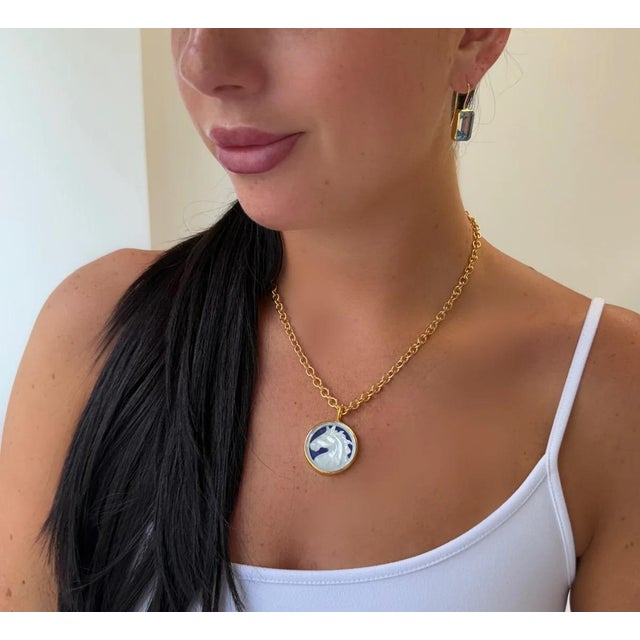 This stunning new, double sided necklace features a carved Mother of pearl horse on one side and Lapis Lazuli on the other...