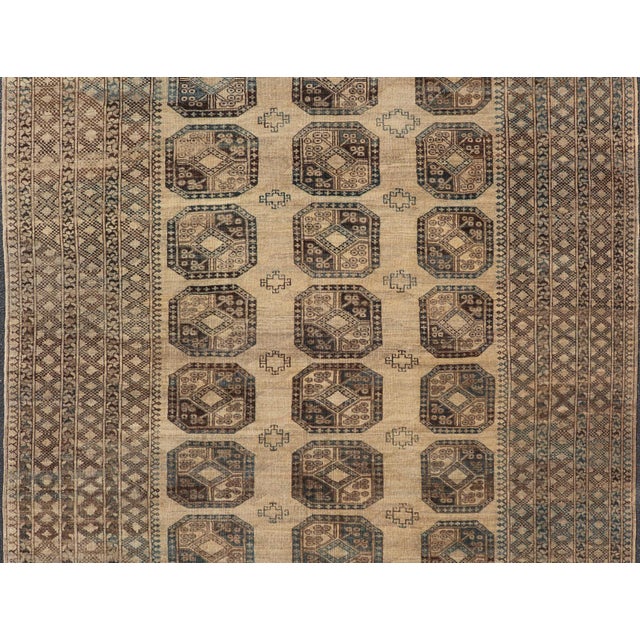 Measures: 8'7 x 11'10 Antique Ersari Rug Sophisticated Medallion Patterns in Earthy Tones 8'7 x 11'10 . Keivan Woven Arts...