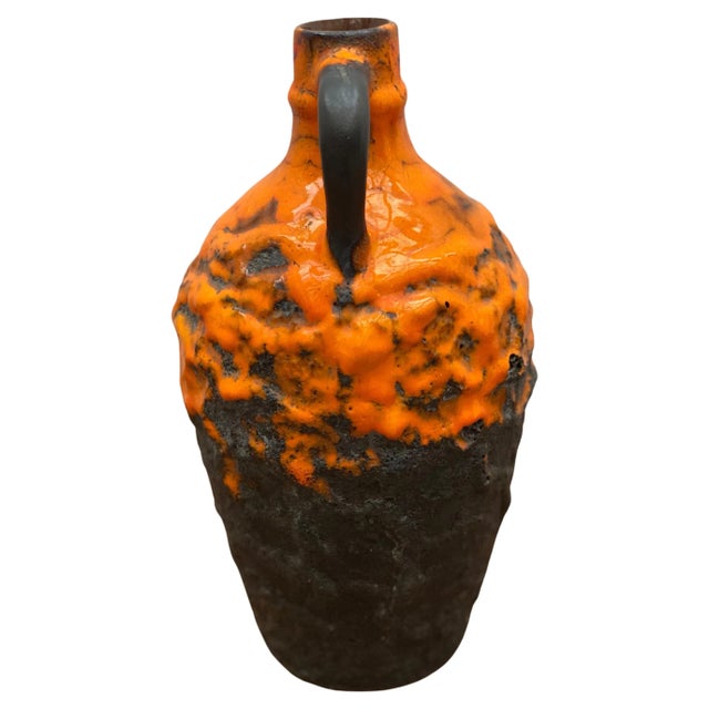 An orange, brown fat lava ceramic vase designed and manufactured in Germany by Carstens in perfect condition signed on the...