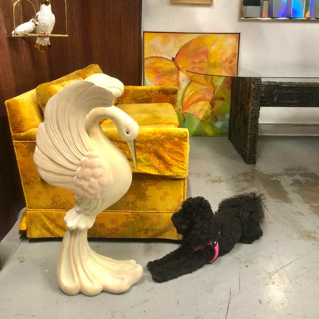 Stunning hand-carved swan resting on top of a wave. Painted, whitewashed wood with pastel tints and a solid brass beak....